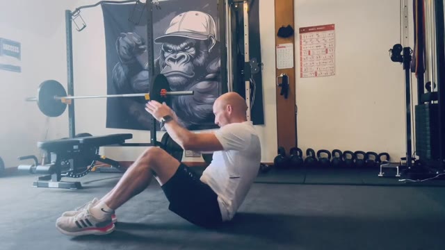 Russian twist with feet down