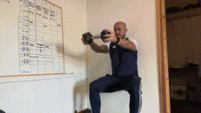 Wall sit dumbbell hold